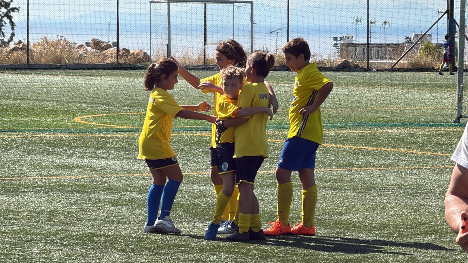 coach with kid playing